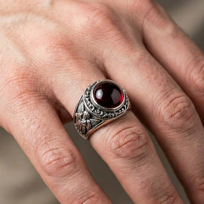 A man wearing the gothic cupid love ring, showcasing its bold statement size.