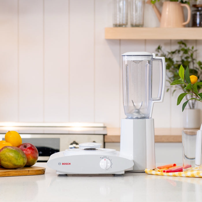 Bosch blender attachment on white counter with kitchen in background