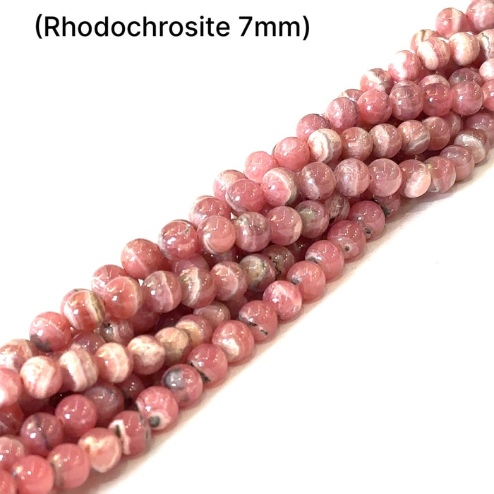 7mm Rhodochrosite smooth round gemstone strand on a white background, front overview.