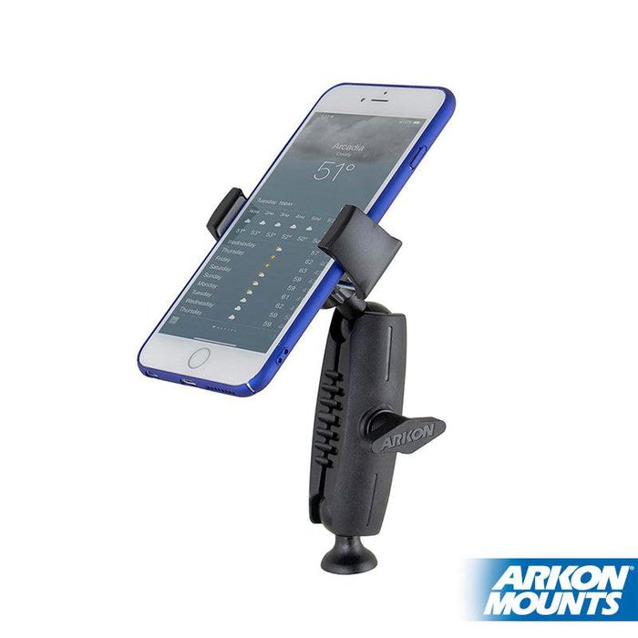 A smartphone displaying a weather app is secured in a black Mobile Grip 5 Tripod Phone Mount, serving as a sturdy tripod phone holder. The Arkon Mounts logo appears in the bottom right corner.
