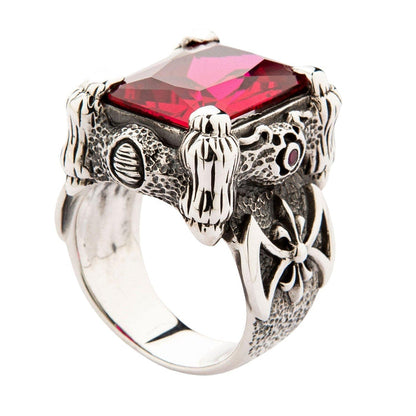 The large red stone ring in a gothic style, showing the warrior axe detail on the textured solid silver band.