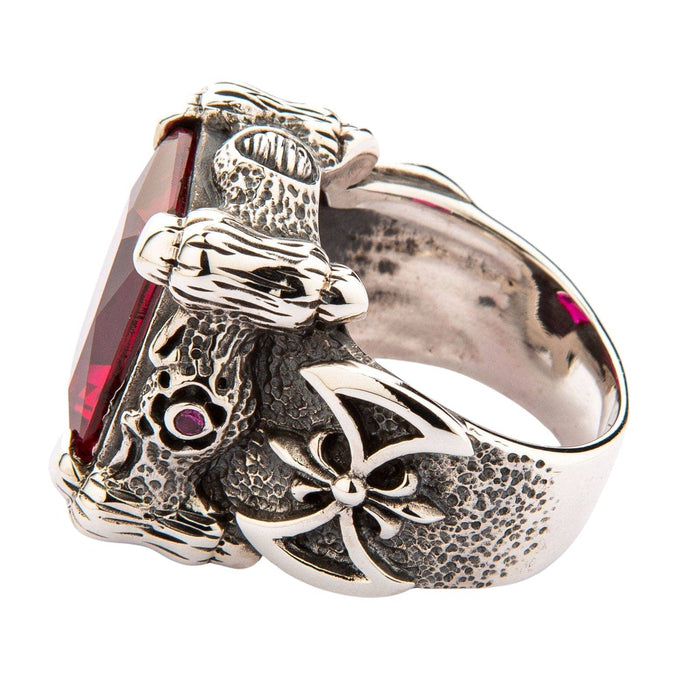 The handcrafted dragon claw setting of the sterling silver ring, shown from the side to highlight its 3D design.