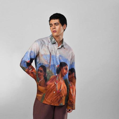 Man wearing the Shakuntala Vintage shirt with brown trousers, three-quarter view, with Raja Ravi Varma artwork