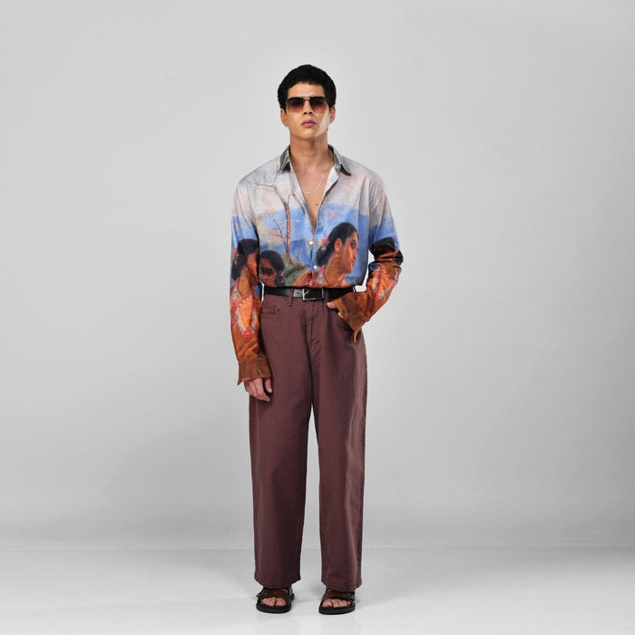 Man wearing the Shakuntala Vintage shirt with brown trousers and sunglasses, full length front view, hand in pocket