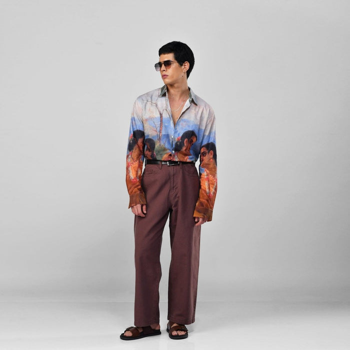 Man wearing the Shakuntala Vintage shirt with brown trousers and sunglasses, full length three-quarter view