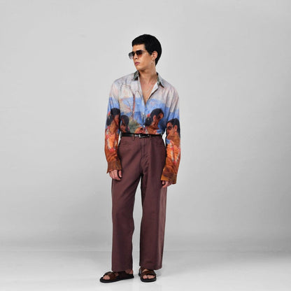 Man wearing the Shakuntala Vintage shirt with brown trousers and sunglasses, full length three-quarter view