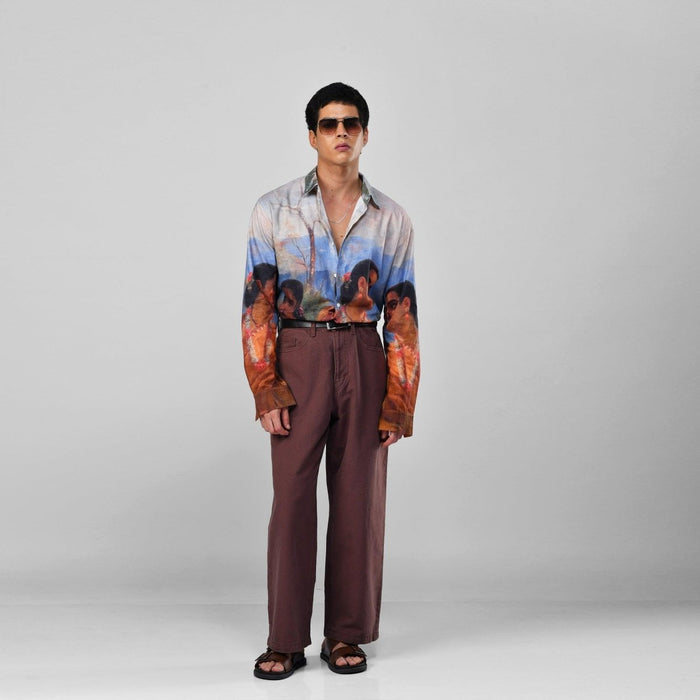 Man wearing the Shakuntala Vintage shirt with brown trousers and sunglasses, full length front view, arms at his sides