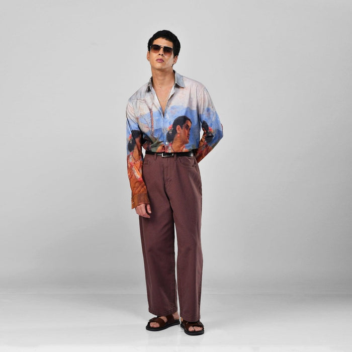 Man wearing the Shakuntala Vintage shirt with brown trousers and sunglasses, full length angled front view, hand on hip