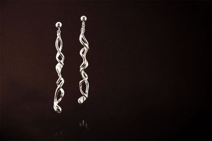 Silver Earrings: Long, Elegant and unique. They have a story to tell..