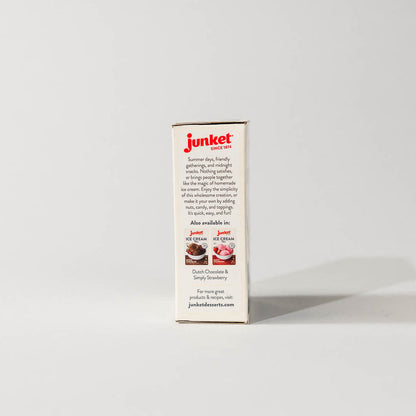 Side view of a single pack of junket very vanilla ice cream mix on a grey background