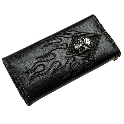 Angled studio view showing the raised skull mount, stitched flame outlines, and braided leather edging on white