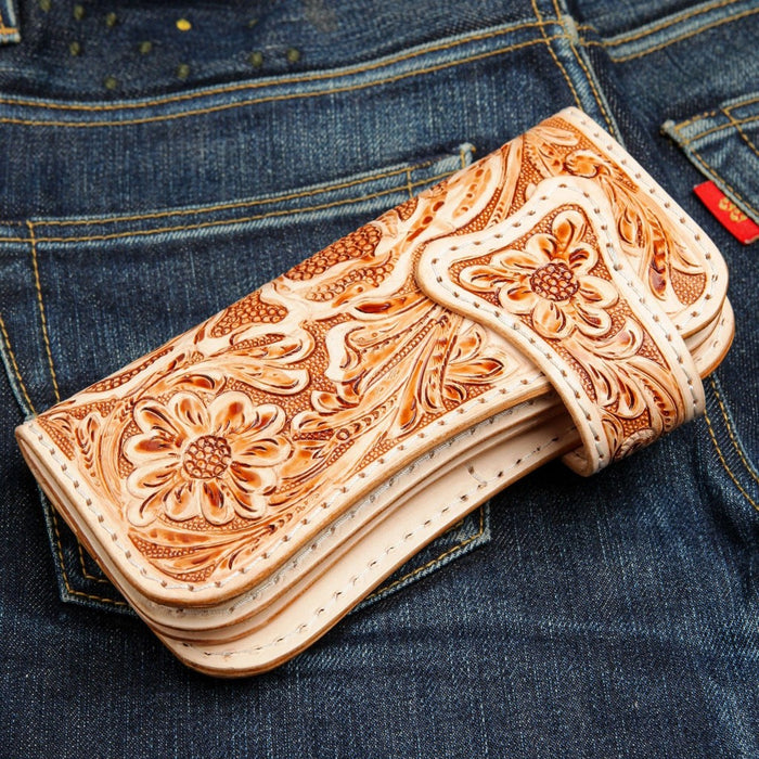 Hand tooled floral leather wallet showcasing artisan crafted scrollwork design