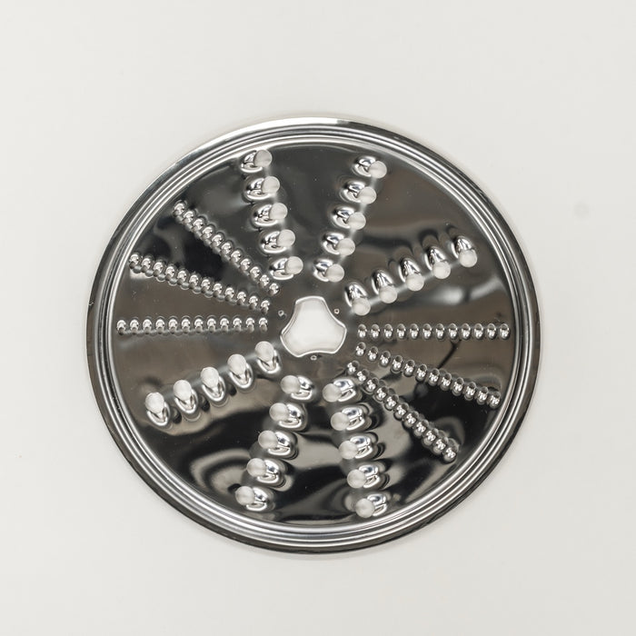 NutriMill slicer shredder replacement disk - reversible shredding on grey background