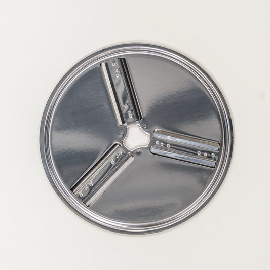NutriMill shredder replacement disk - reversible slicing on grey background