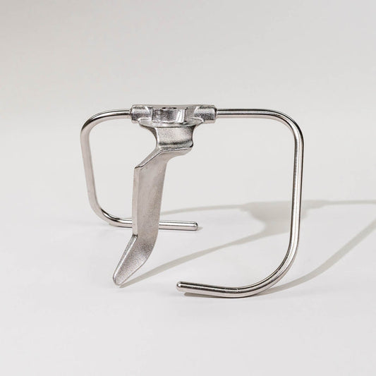 A silver stainless steel dough hook against a white background.