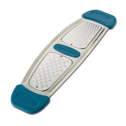 Experience effortless citrus zesting with the Stainless Steel Multi-Grater, featuring blue and silver dual-sided construction with ergonomic silicone handles and stainless steel blades.