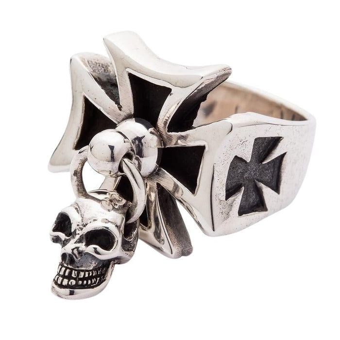 Angled view showing the depth of the iron cross and hanging skull pendant