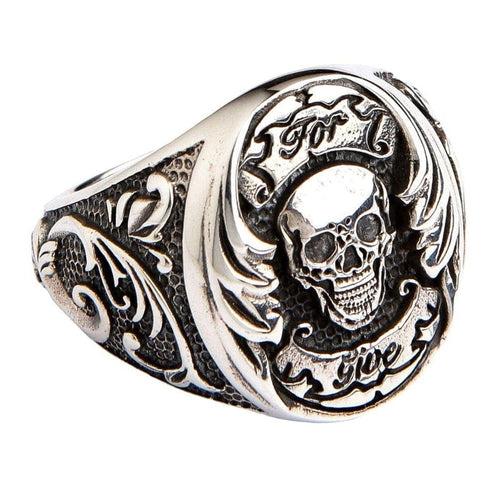 A men's solid sterling silver Por Vida skull ring, a piece of Chicano-style biker jewelry.
