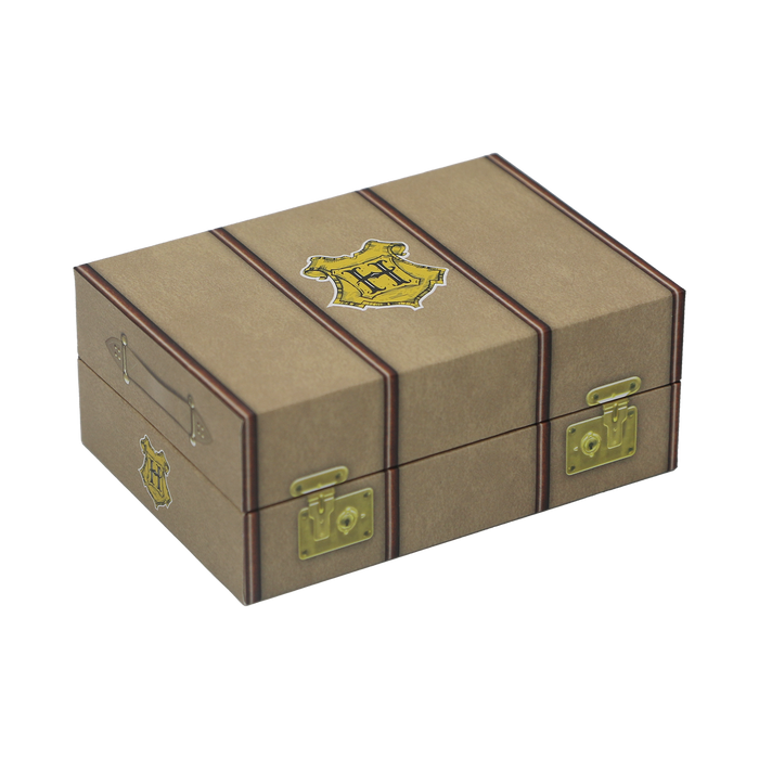 Brown trunk storage box with gold accents and a Hogwarts crest on a white background