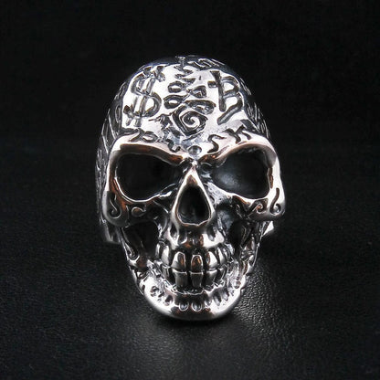 Sterling silver tattoo skull ring front view showing detailed engravings and hollow eyes