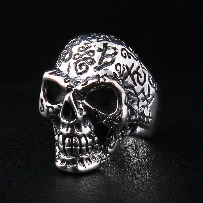 Handcrafted gothic skull ring with tattoo style symbols in solid silver