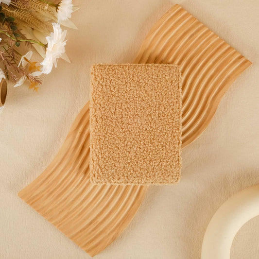 Textured brown square on a beige background with decorative elements