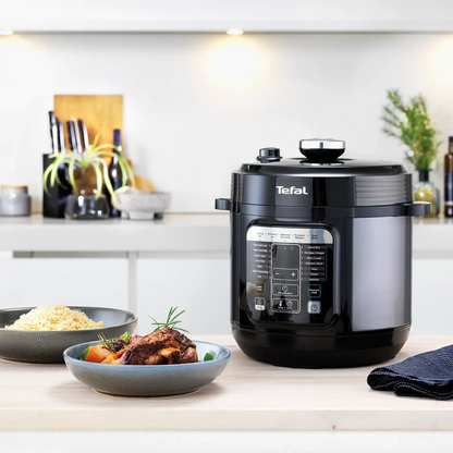 Tefal Home Chef Smart Multicooker CY601 Rice & Multicooker on kitchen counter with food