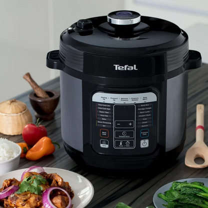 Tefal Home Chef Smart Multicooker CY601 Rice & Multicooker on kitchen bench with food