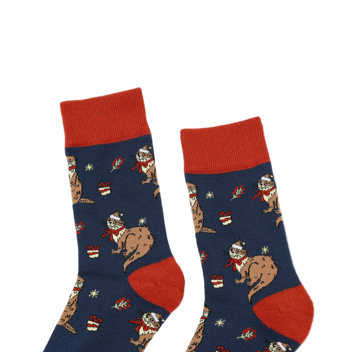 Pair of Christmas Otter socks socks with red accents on a white background