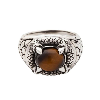 Tiger's eye claw ring front view showing a 14mm × 12mm tiger's eye cabochon in a four-claw 925 sterling silver dragon-scale setting.