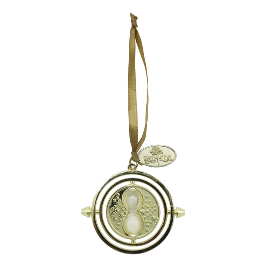 Gold time-turner ornament with a ribbon on a white background