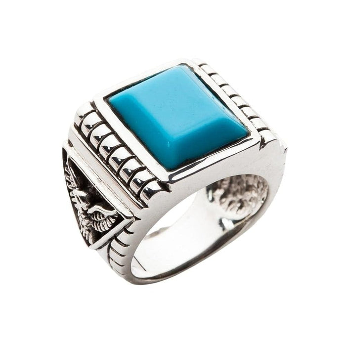Front view of the genuine Turquoise eagle ring, showing the large square blue stone and polished silver finish.