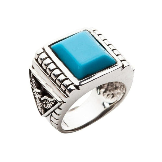 Front view of the genuine Turquoise eagle ring, showing the large square blue stone and polished silver finish.