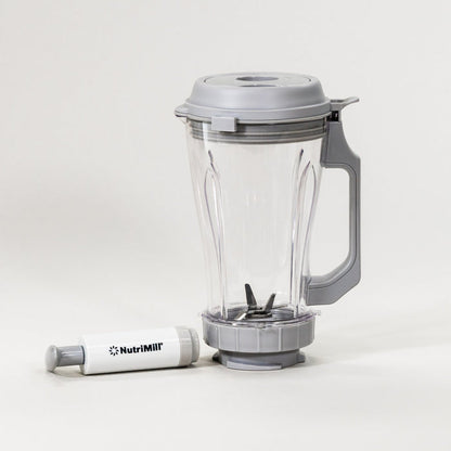 NutriMill vacuum blender attachment on a grey background