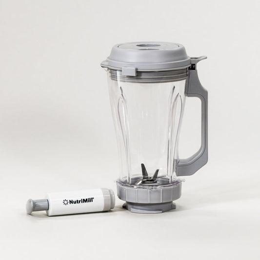 NutriMill vacuum blender attachment on a grey background