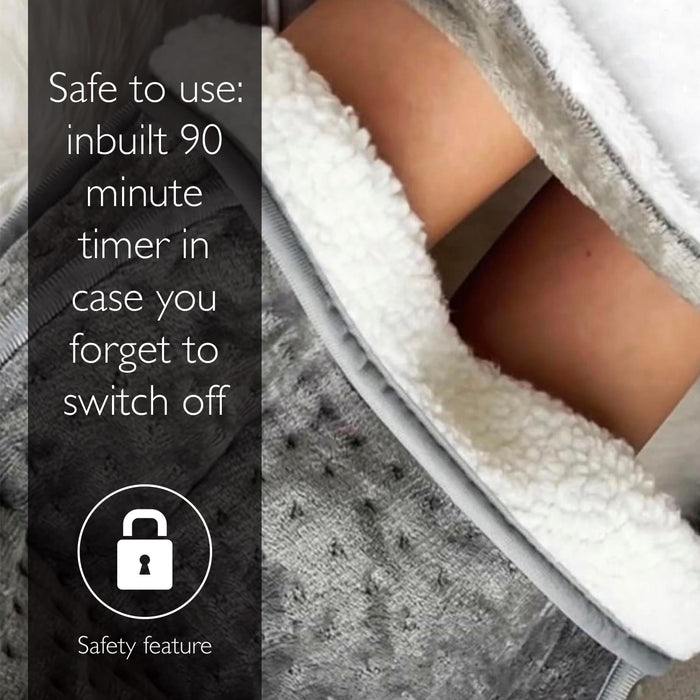Person using a foot spa with text about a safety feature, including a timer.- Buy Now Cream Luxury Heated Throw + Foot Warmer