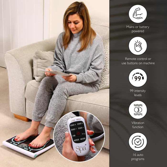 Woman using a home massager with remote control in a living room setting - Buy Now Foot & Legs EMS Machine + EMS & Heat Massager