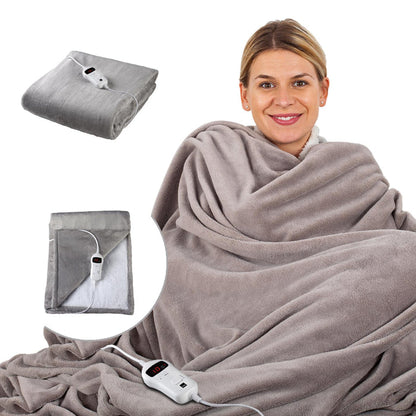 Woman wrapped in a gray electric blanket with controllers on a white background - Buy Now Grey Luxury Heated Throw + Foot Warmer