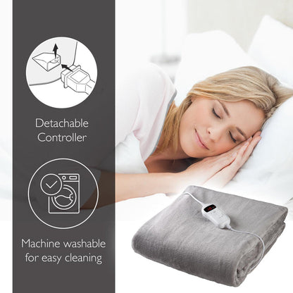 Woman lying in bed with a gray electric blanket, featuring detachable controller and machine washable text. - Buy Now Grey Luxury Heated Throw + Foot Warmer
