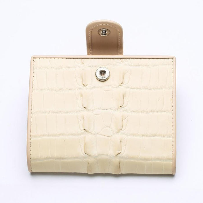 Front view of a genuine white pearl crocodile leather wallet for women, featuring a classic snap button closure and unique scale texture.