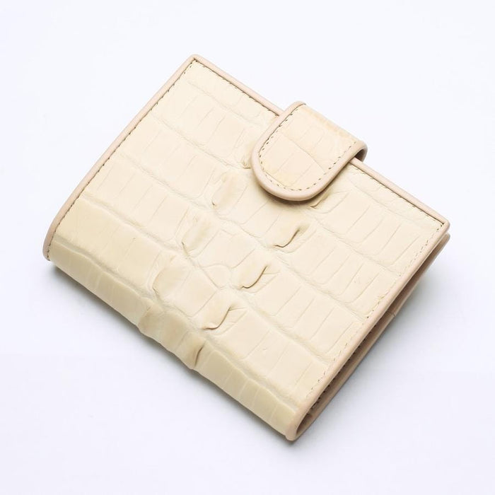 The white pearl crocodile wallet presented as an elegant gift idea for women.
