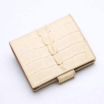 Back view of the compact bi-fold wallet highlighting the continuous crocodile leather design.