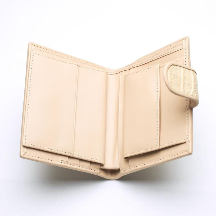 Interior view of the beige leather wallet showing 6 card slots and ID window.