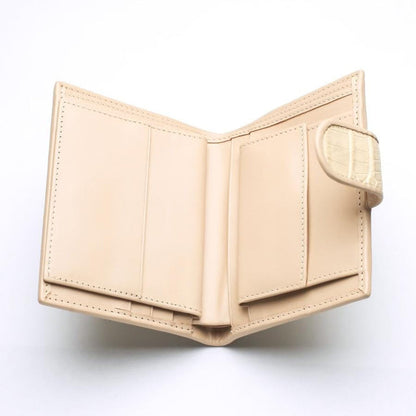 Interior view of the beige leather wallet showing 6 card slots and ID window.