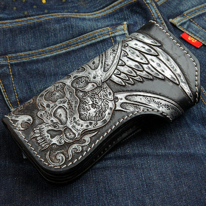 Side view of the hand-carved leather wallet, focusing on the angel wing detail.