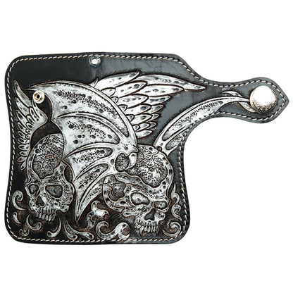 Full open view of the hand-carved winged skull leather wallet, showing the complete angel and demon skull design.
