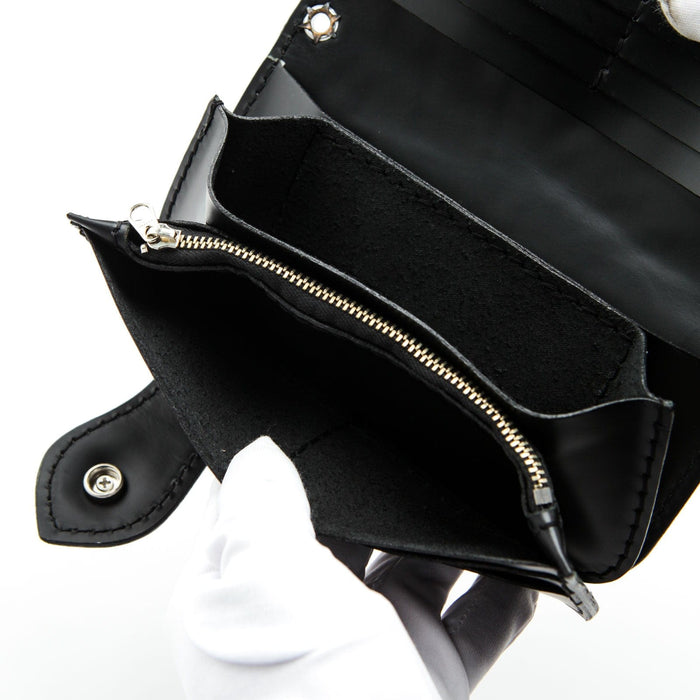 A close-up of the long zipper compartment inside the leather biker wallet for coins.
