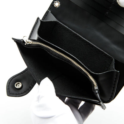 A close-up of the long zipper compartment inside the leather biker wallet for coins.