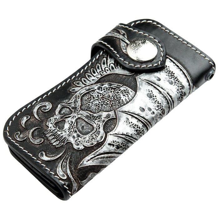 The hand-carved leather biker wallet folded, showing the snap closure and winged skull detail.
