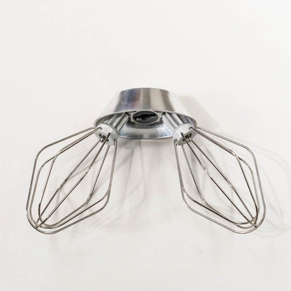 NutriMill wire whips attached to a metal whip driver on a grey background